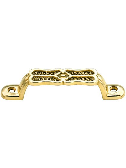 Ornamental Cast Brass Drawer Pull - 3 1/8 inch Center to Center in Un-lacquered Brass.